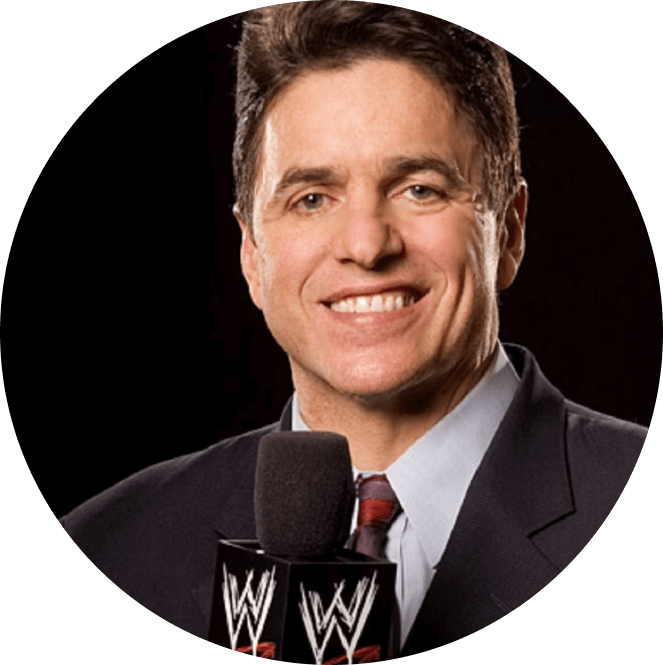 Former NFL player and sportscaster Mike Adamle holding a WWE microphone
