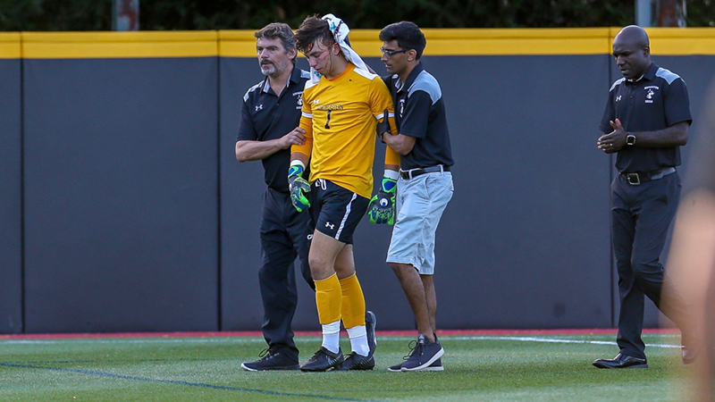 Former soccer player Noah Abrams leaves the game after suffering a concussion