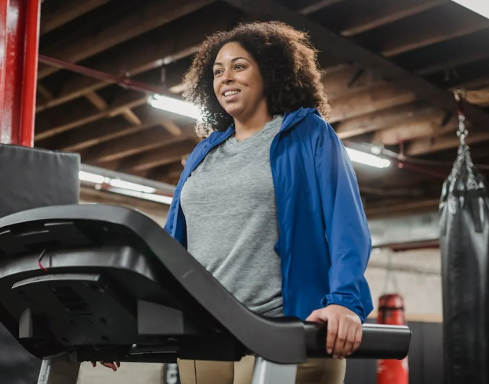 Patient exercises on the treadmill at the gym