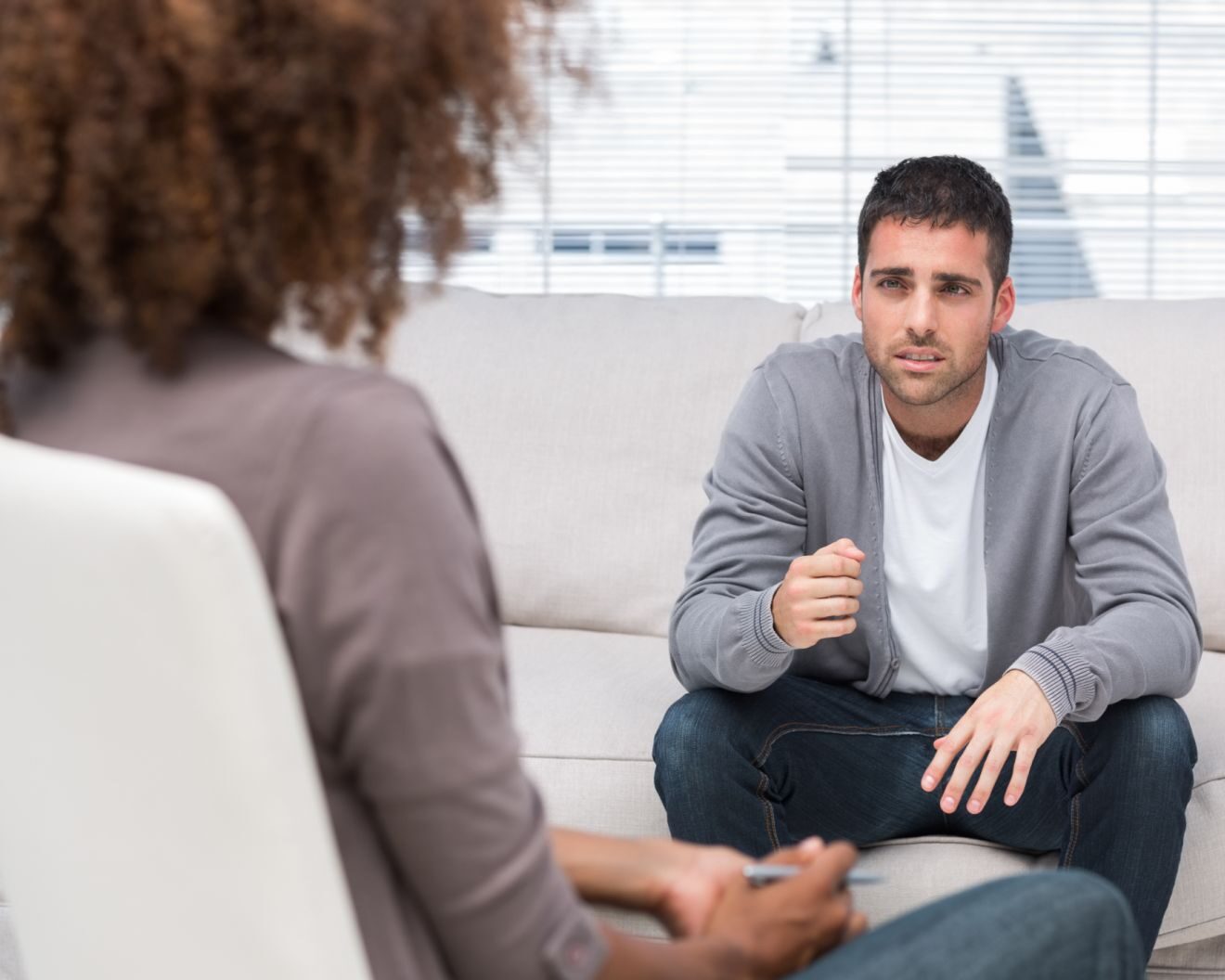 A psychologist helps a patient develop coping strategies to help manage symptoms of post-concussion syndrome (PCS)