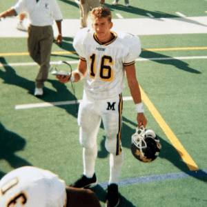 Former football player Ryan O'Malley in uniform on the football field.