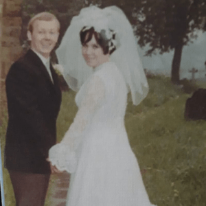 Former professional soccer player John Tudor with his wife on their wedding day