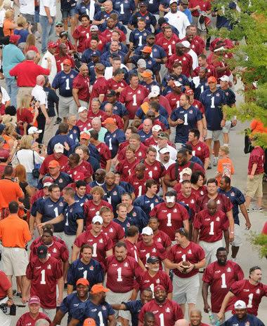 Football fans attending the Iron Bowl between Alabama and Auburn