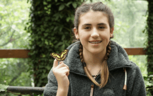 Legacy Donor Alyssa Peterson holding a butterfly