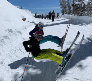 Legacy Donor Alyssa Peterson and sister in their skis