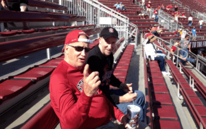 Legacy Donor and former college football player Jim Huge with son at Memorial Stadium