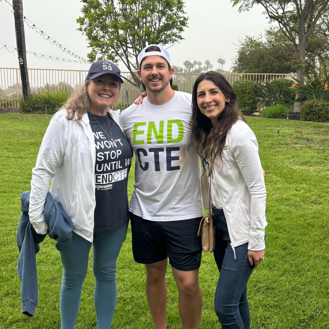 Staff members of the Concussion & CTE Foundation out in a field