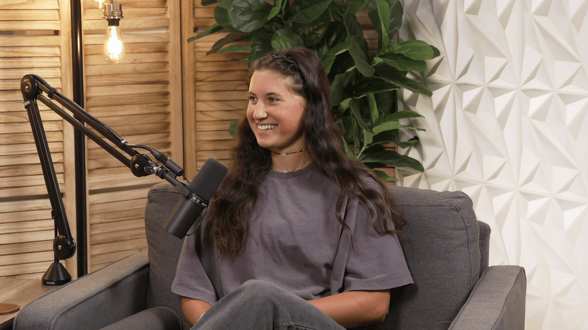 U.S. moguls skier Alli Macuga speaks into a microphone for CLF's Invisible Impact podcast