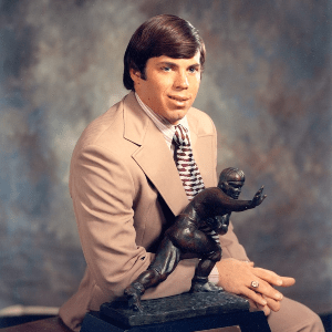 Former NFL player and coach Pat Sullivan with his Heisman trophy