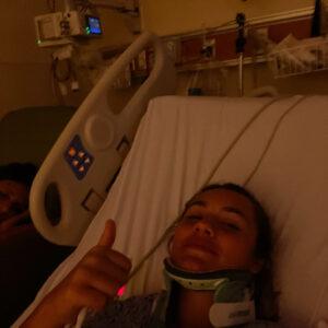 Former soccer player Caroline Souza in a bed at the hospital