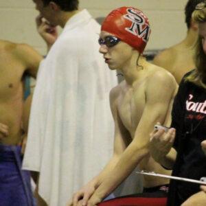 Legacy Donor Liam Roeth in swim cap and goggles at the pool