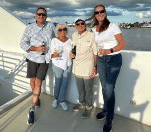 Jim and Caroline Yost on a boat with family