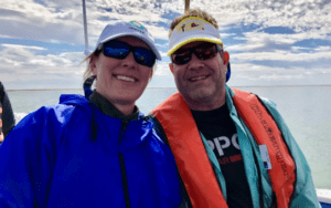 Jim and Caroline Yost on a boat in the sea