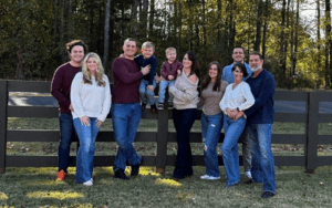 Legacy Donor and former hockey player Cam Brown with family on a farm