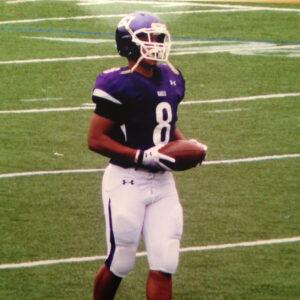Former college football player Marcus Alston in his uniform on the field